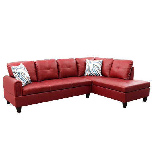 Red leather sectional sofa with tufted cushions and decorative pillows