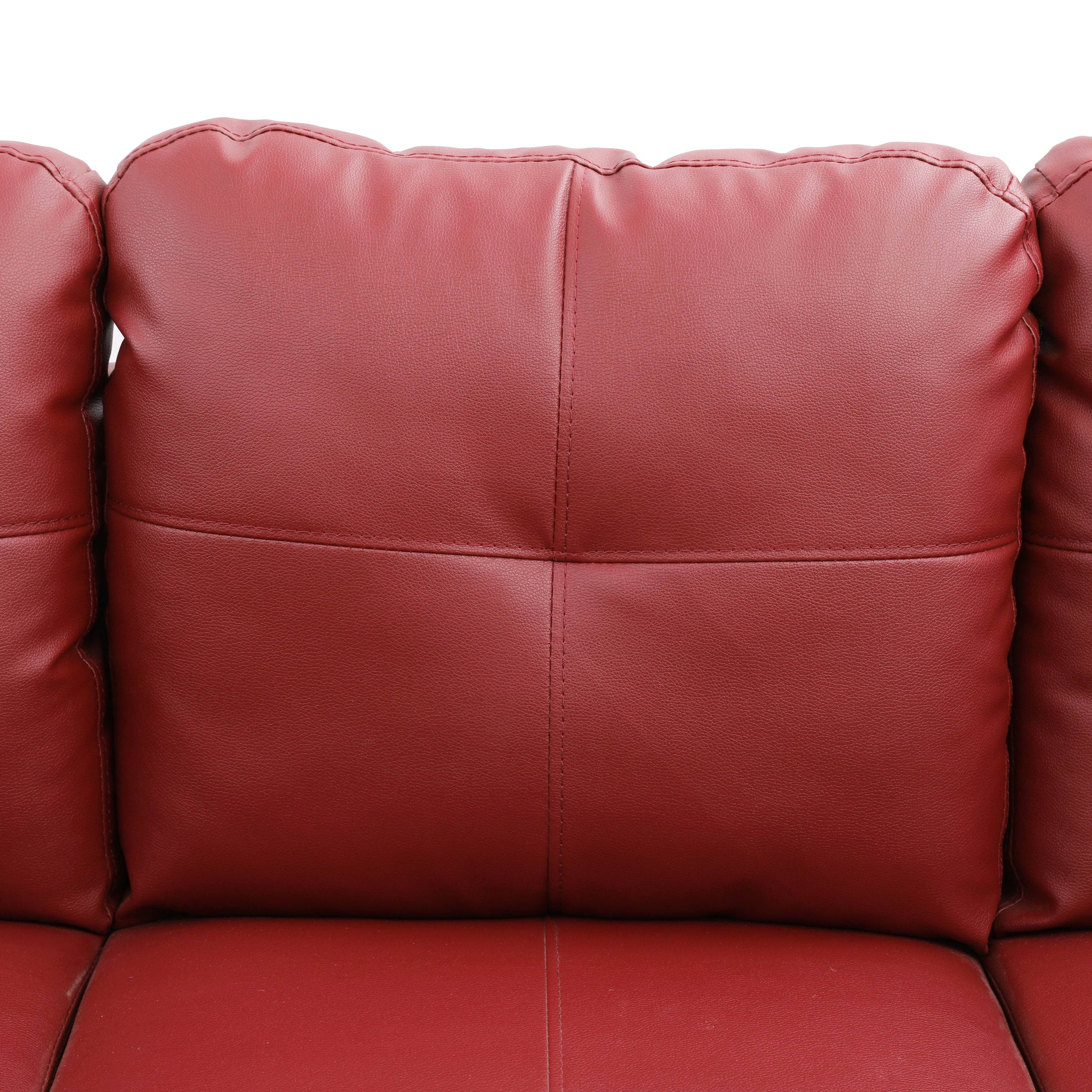 Deep red leather sofa cushion detail with stitched detailing