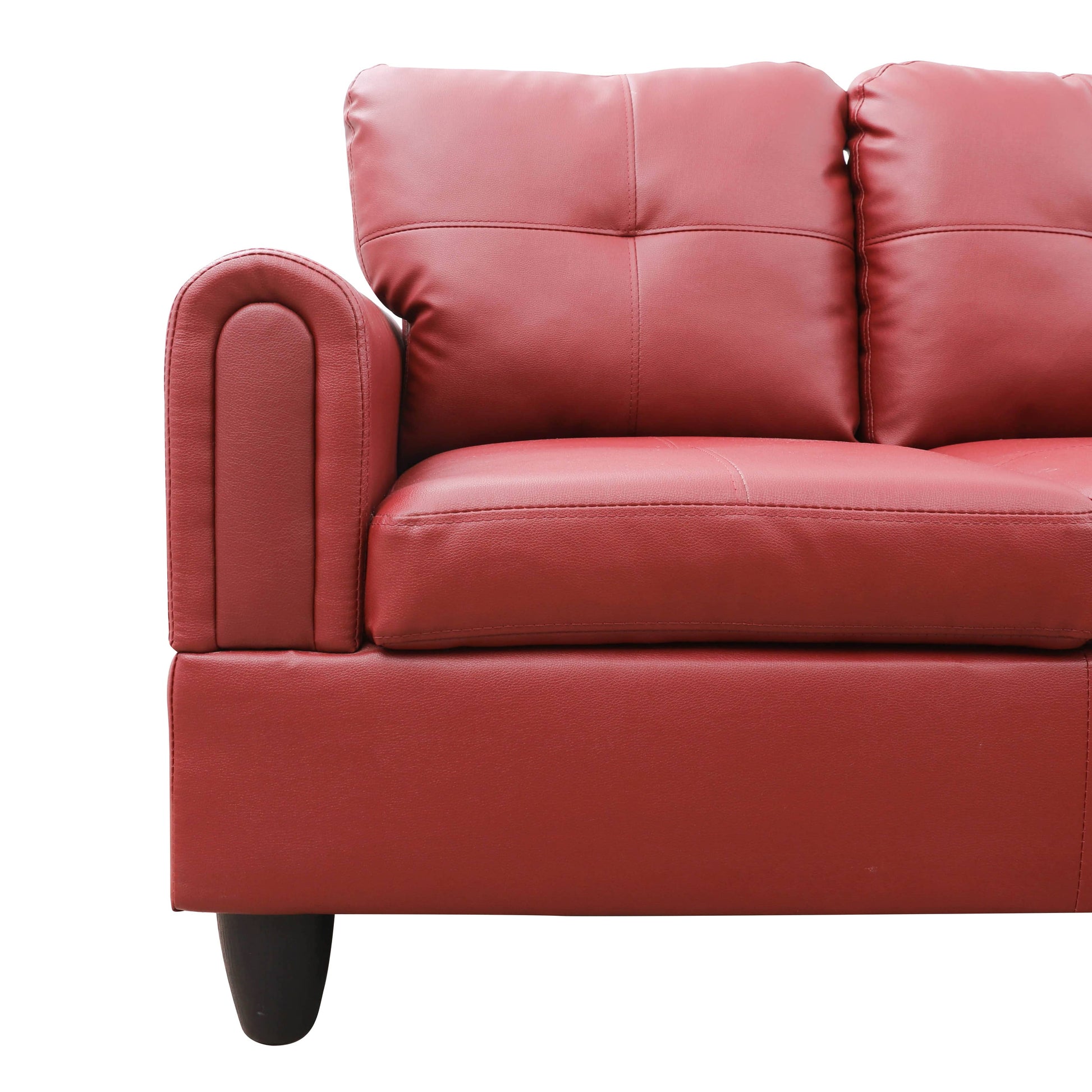 Red faux leather sofa corner with padded armrest