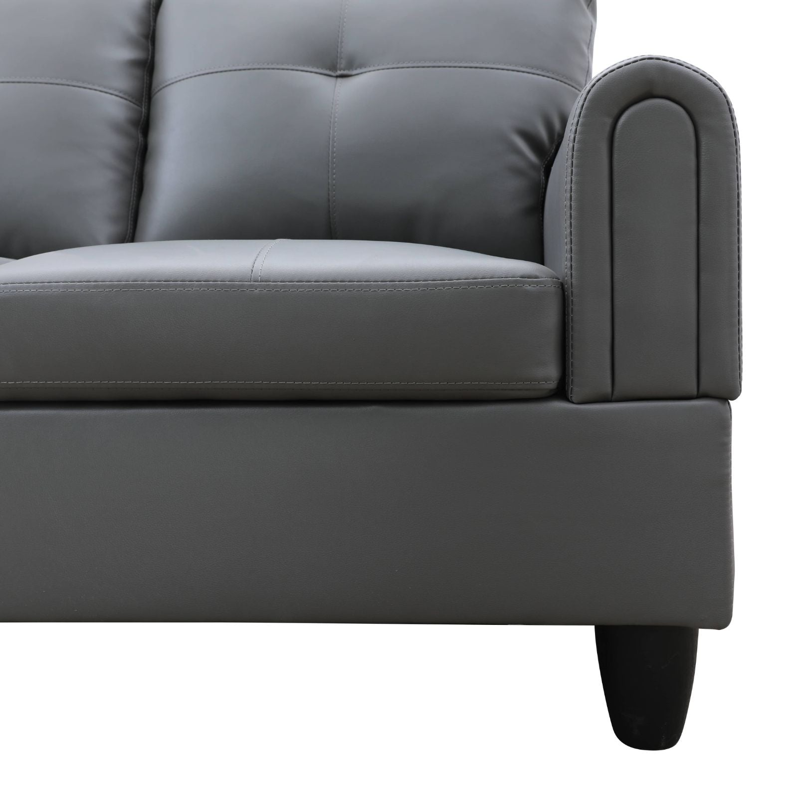 Gray faux leather tufted sofa with stylish rolled armrests
