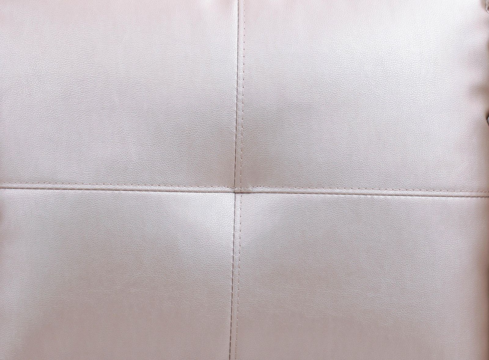 Pale pink faux leather upholstery with stitching detail
