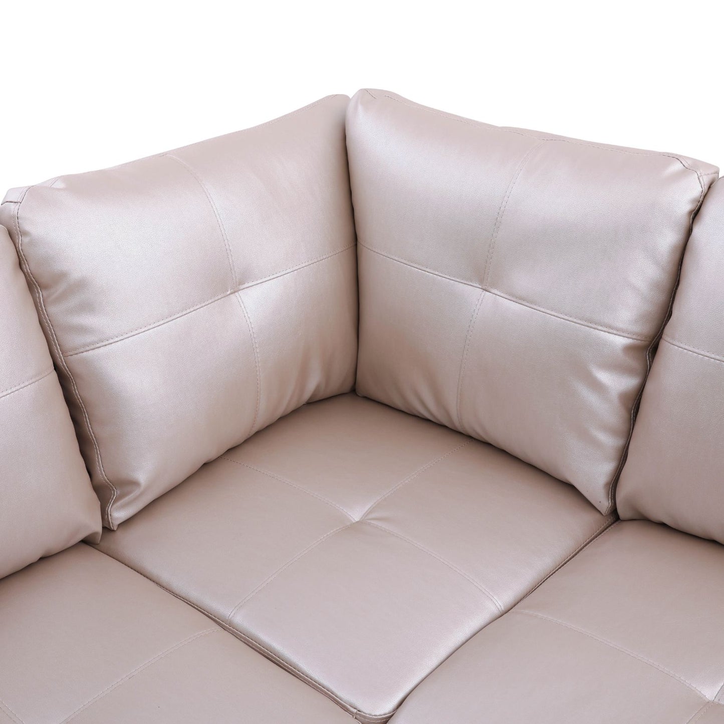 Beige leather sectional sofa with deep diamond tufting