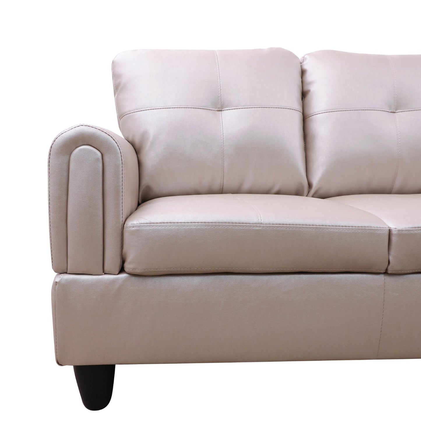 Modern beige leather sofa detail with tufted cushions and curved armrest