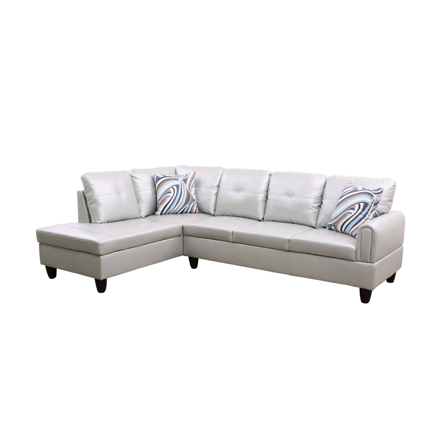 Light grey leather sectional sofa with tufted cushions and striped accent pillows