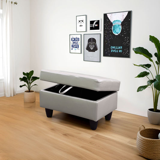 Gray faux leather storage ottoman with lid open