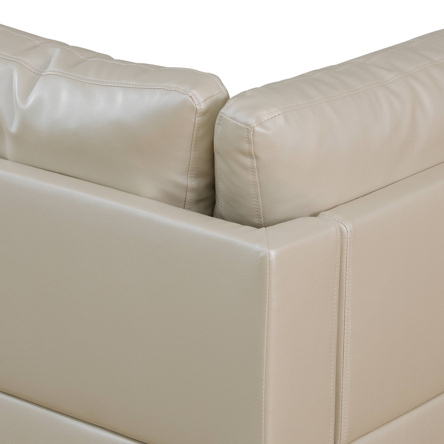 Closeup of beige faux leather sofa armrest with detailed stitching