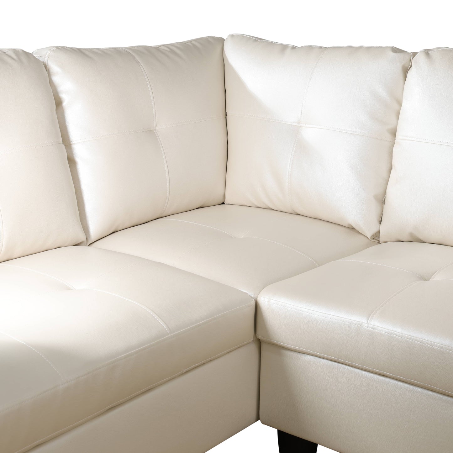 Cream faux leather sectional sofa with tufted back cushions