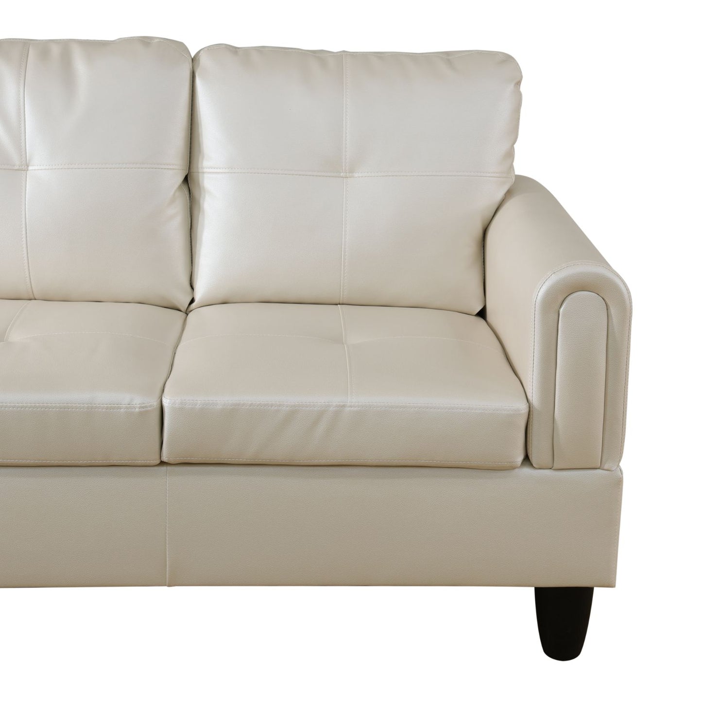 Cream leather sofa with tufted cushions and rounded armrest