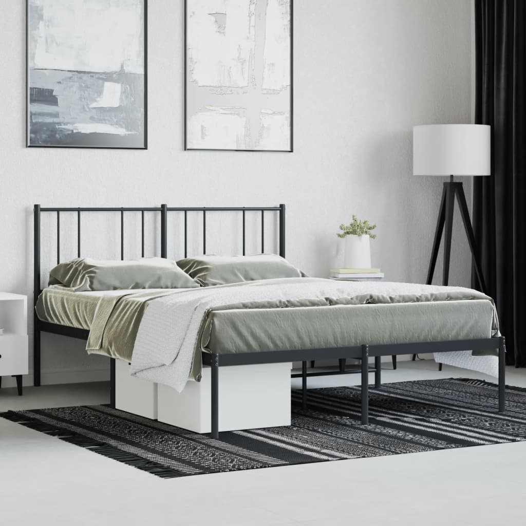 Minimalist black metal bed frame with a geometric patterned duvet