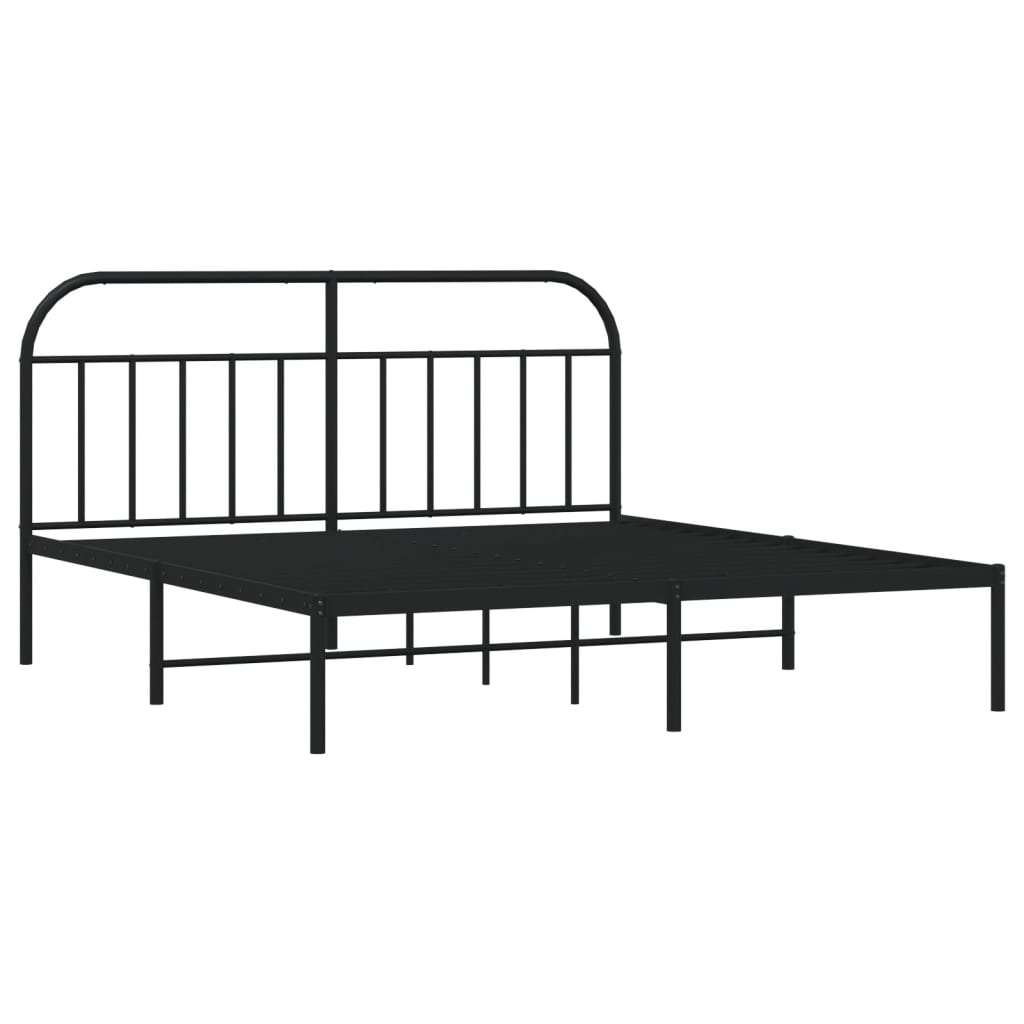 Black metal bed frame with arched headboard and mattress