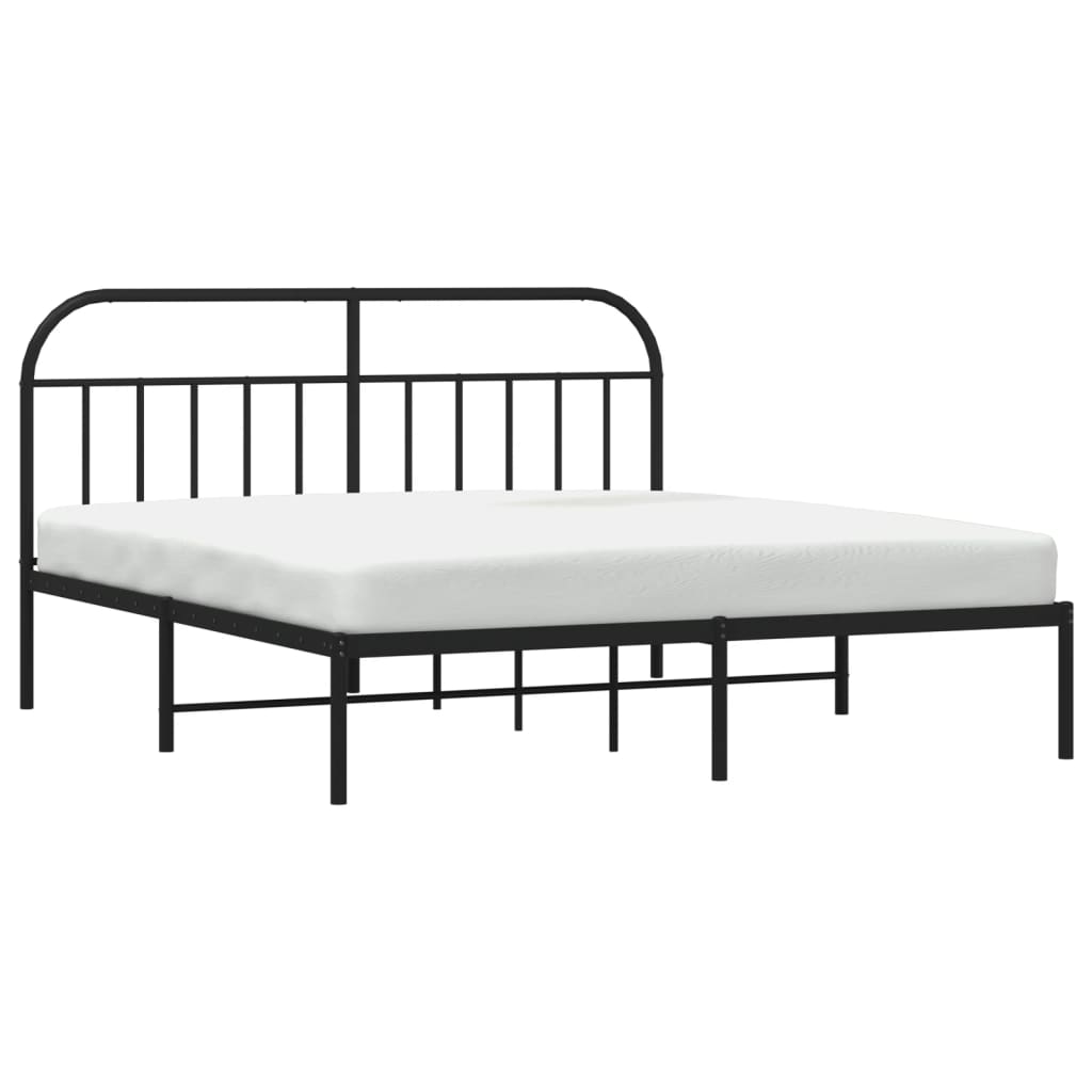Black metal frame bed with arched headboard and footboard