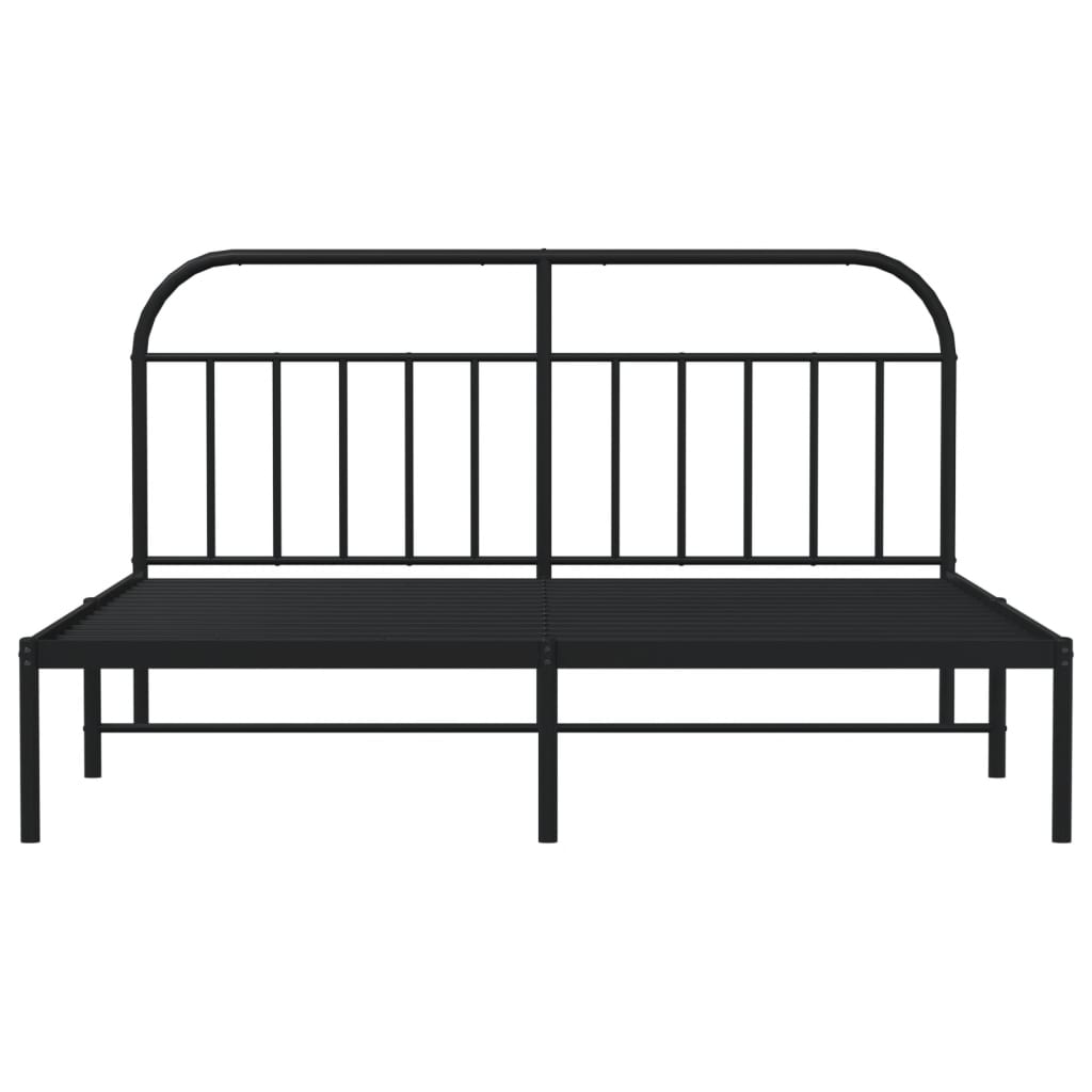 Black metal bed frame with a curved headboard and mattress