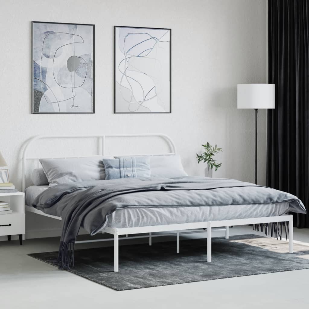 White metal bed frame with arched headboard and slatted base