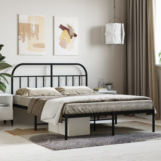 Arched black metal bed frame with twin XL mattress and patterned bedding