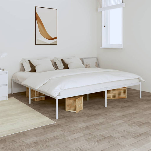 White metal platform bed frame with upholstered headboard and neutral bedding