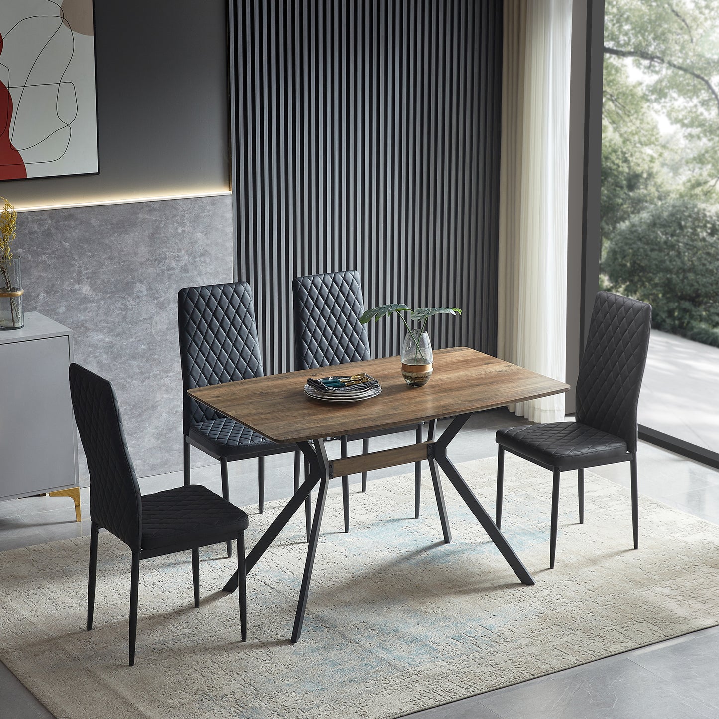 Wooden dining table with black upholstered chairs and diamond stitching