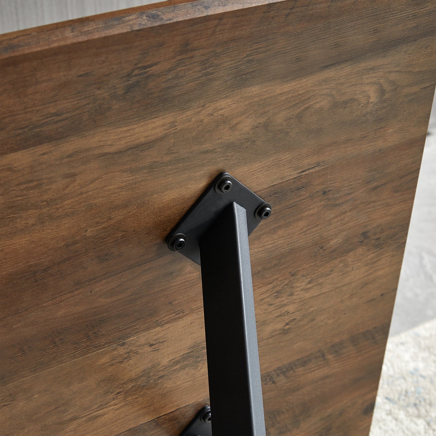 Rustic brown wood grain table top with matte black metal leg mount