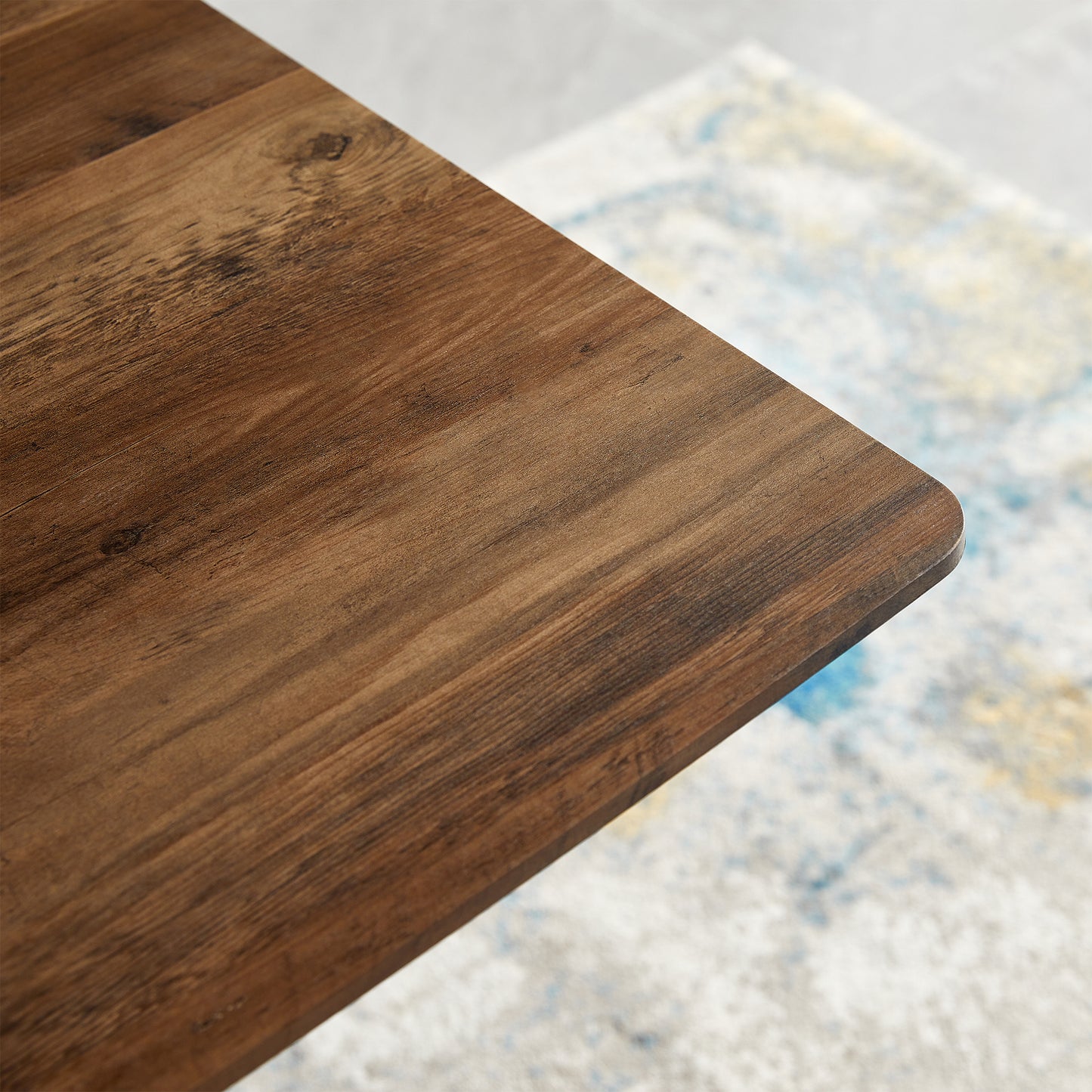 Closeup of rustic dark brown wooden tabletop with visible grain