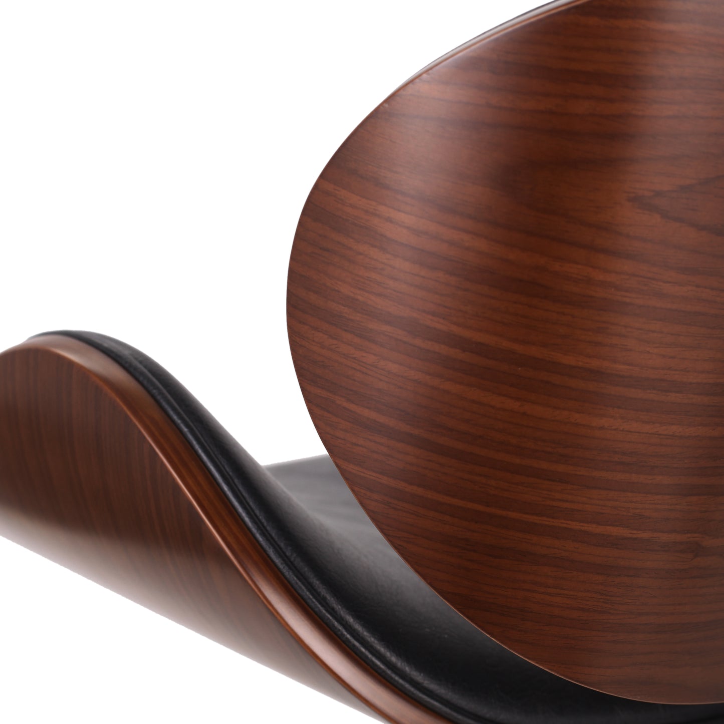 Curved walnut veneer chair with black leather seat detail
