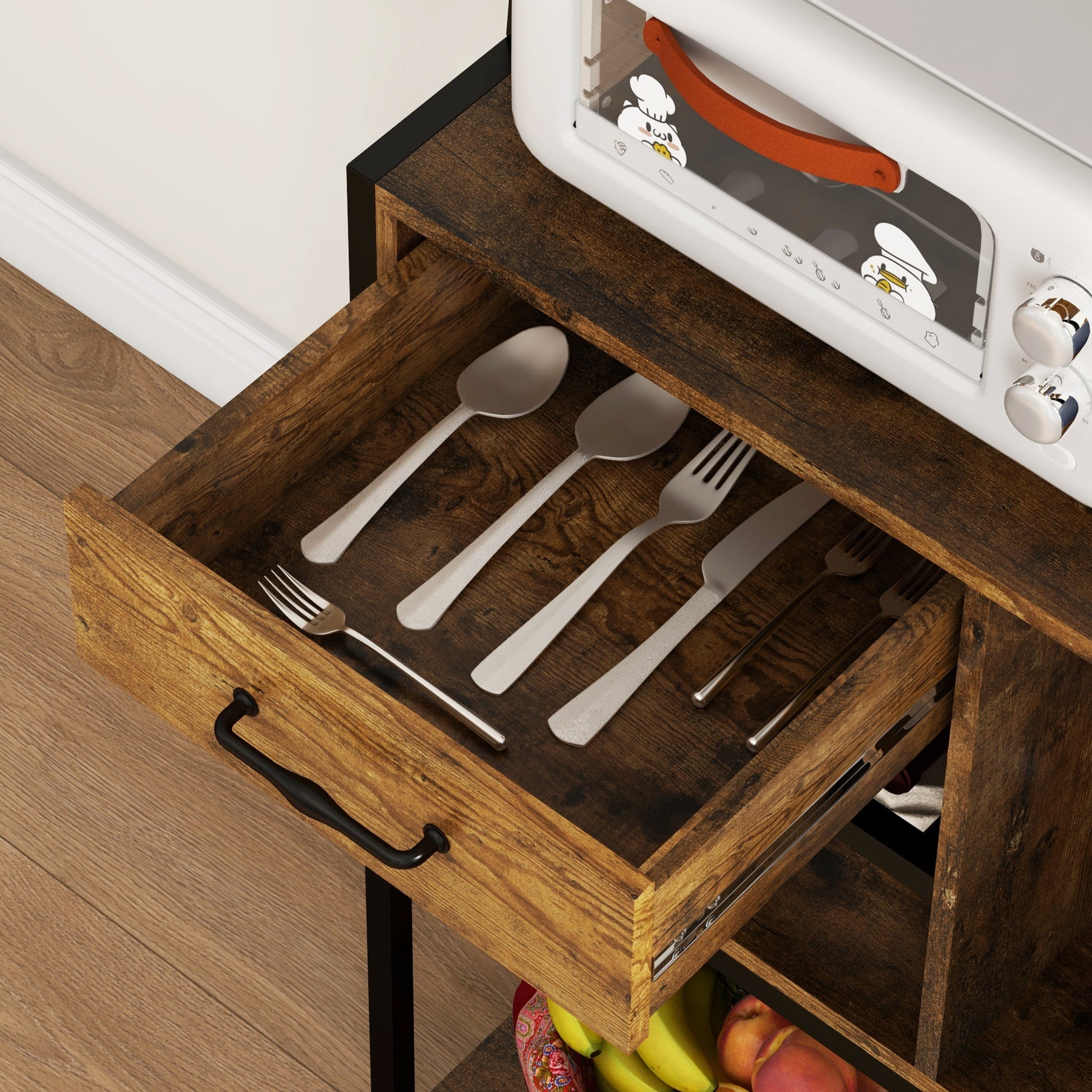 Silverware set including spoons and forks in a wooden drawer
