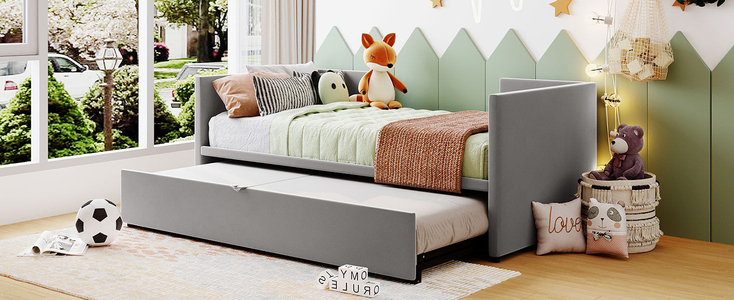 Grey upholstered twin daybed with pullout trundle perfect for kids rooms