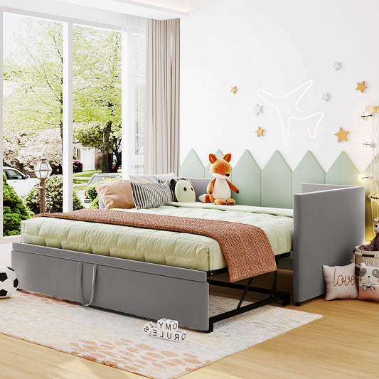 Gray fabric twin daybed with pullout trundle and quilted mattress