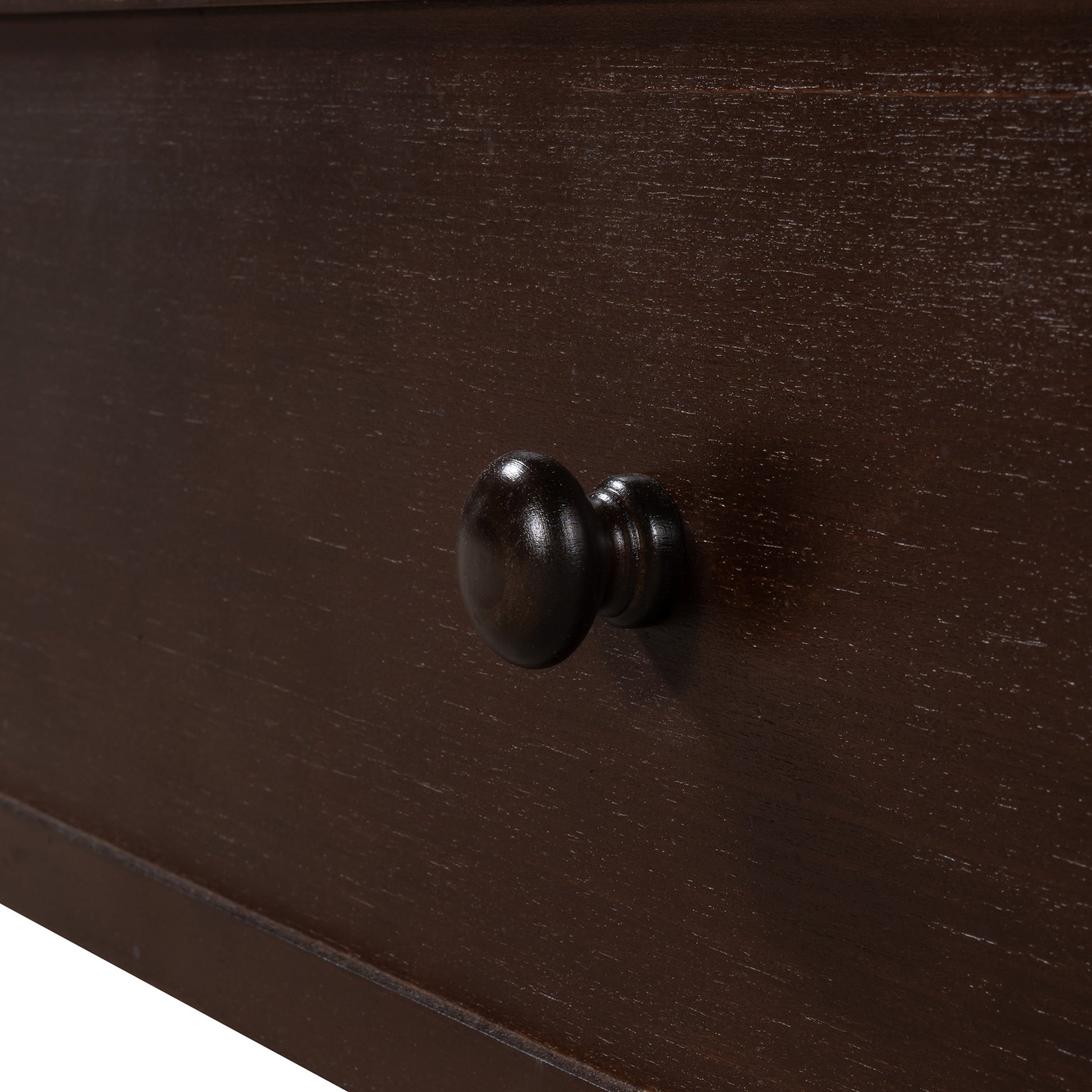 Dark brown wooden dresser drawer with round knob