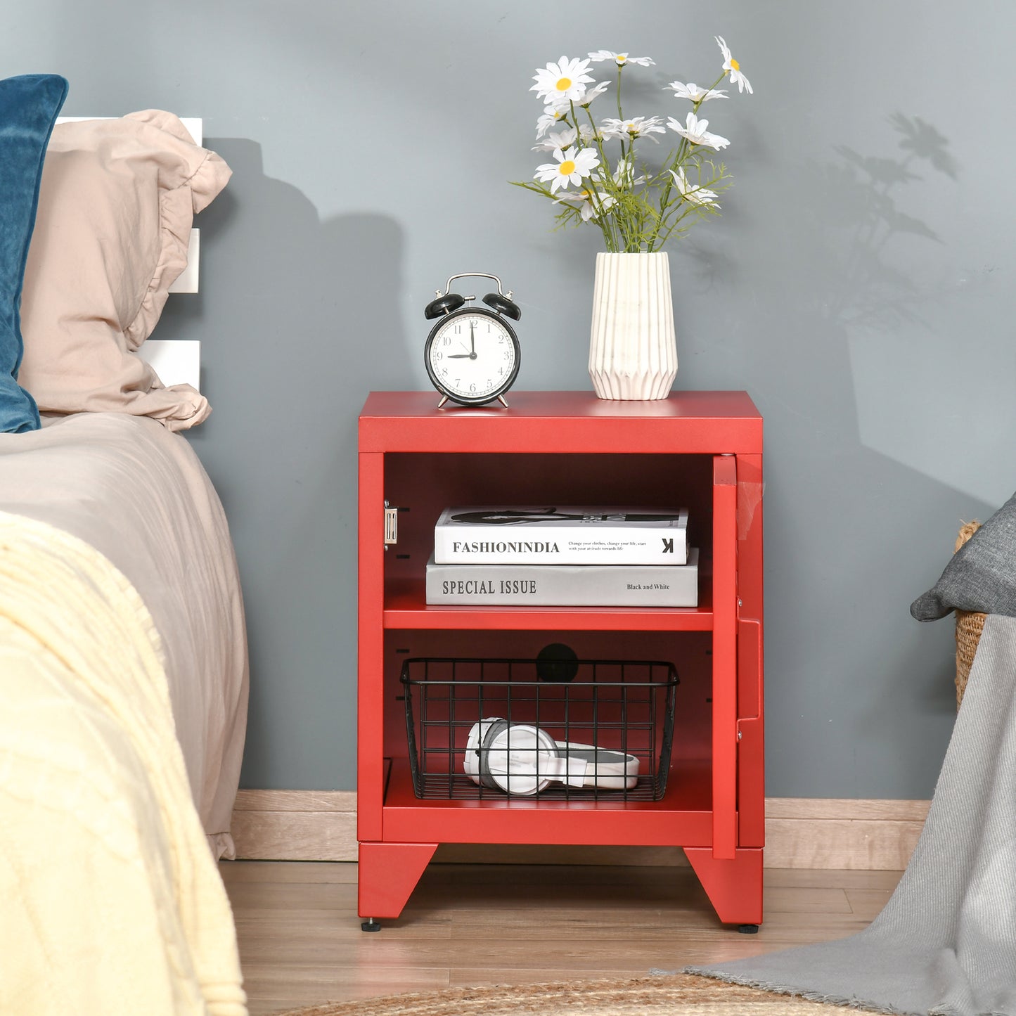 Red metal bedside table with two shelves and a closed compartment
