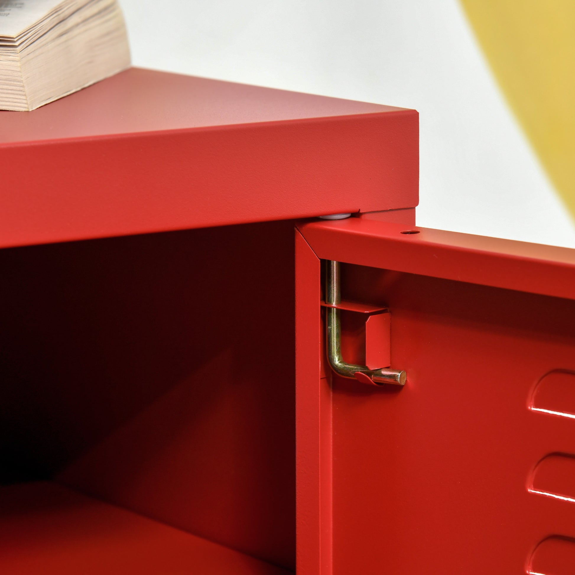 Red metal locker door with gold latch