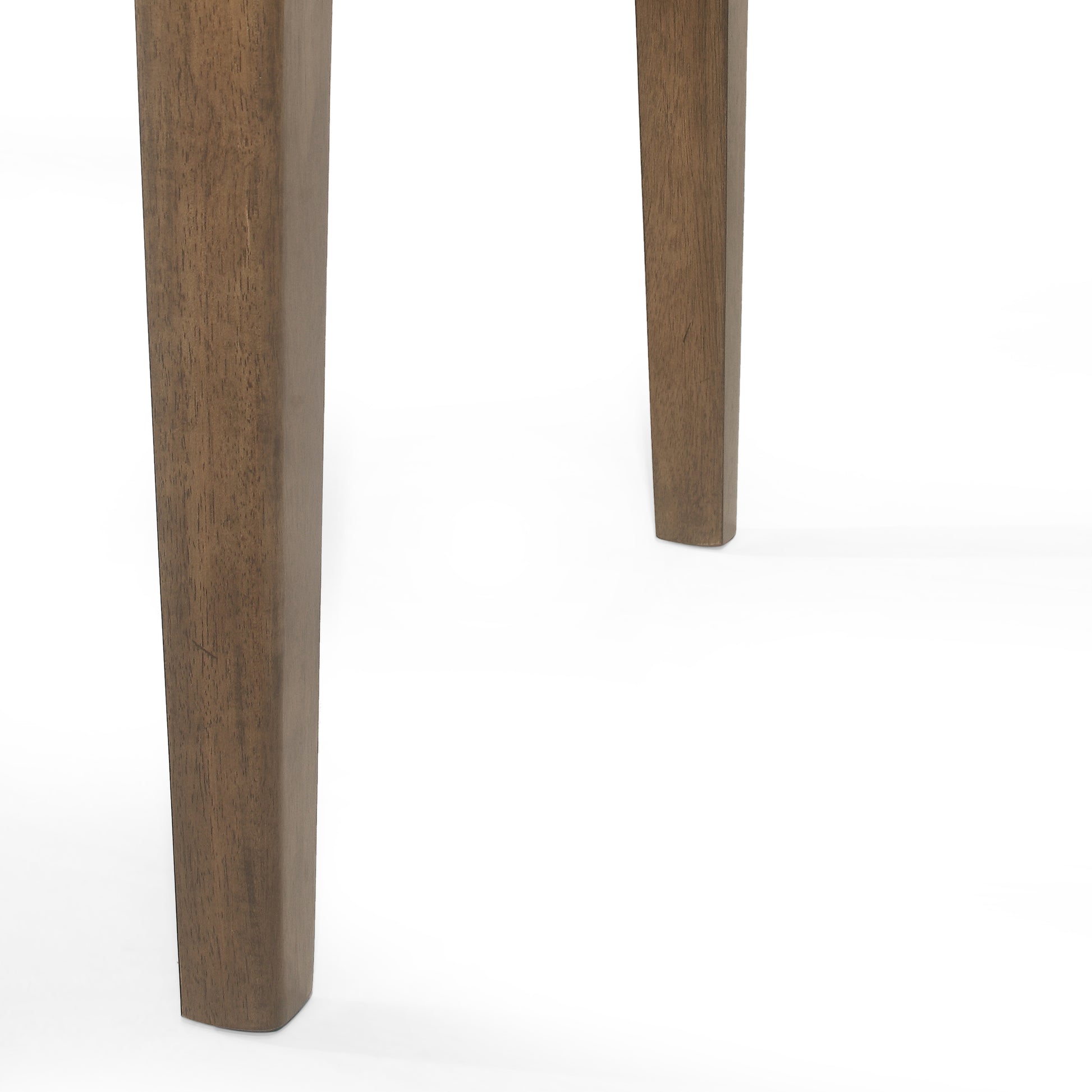 Closeup of dark wood table legs showing grain texture