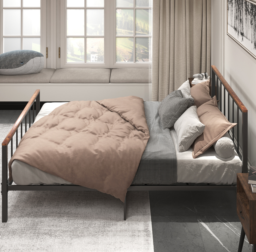 Bronze and black metal daybed with plush taupe duvet and accent pillows