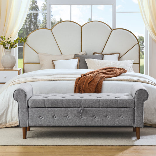 Tufted grey storage bench with rolled arms and wooden legs