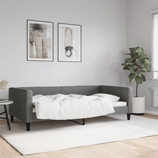 Modern gray sofa bed with white bedding pulled back
