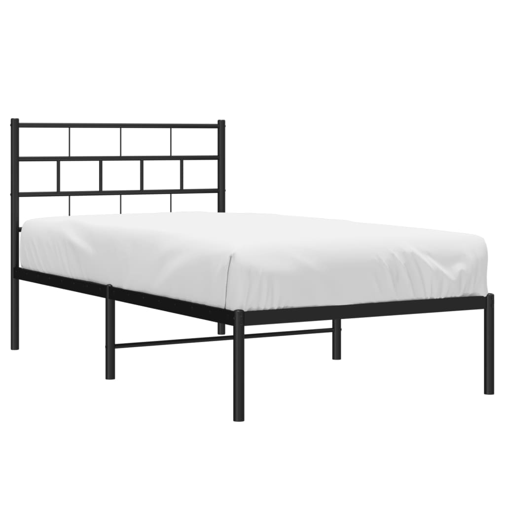 Black metal twin bed frame with a minimalist geometric headboard and white mattress