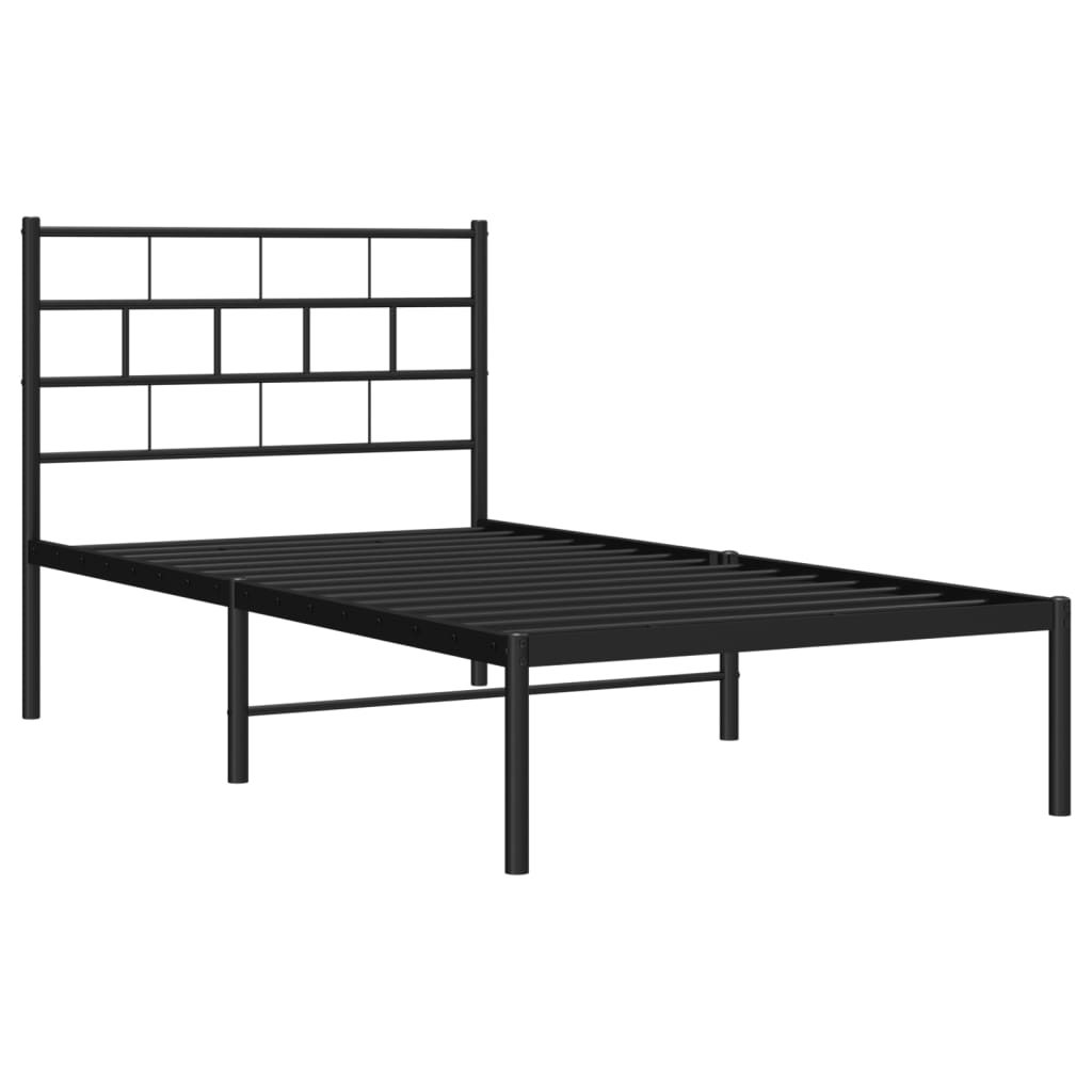 Black metal bed frame with a modern geometric headboard and a white mattress