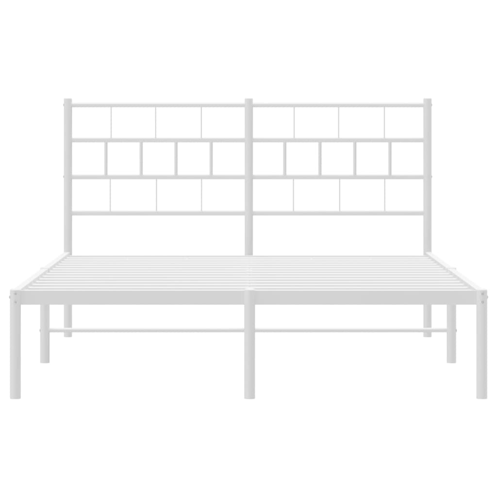 White metal bed frame with a grid headboard and kingsize mattress