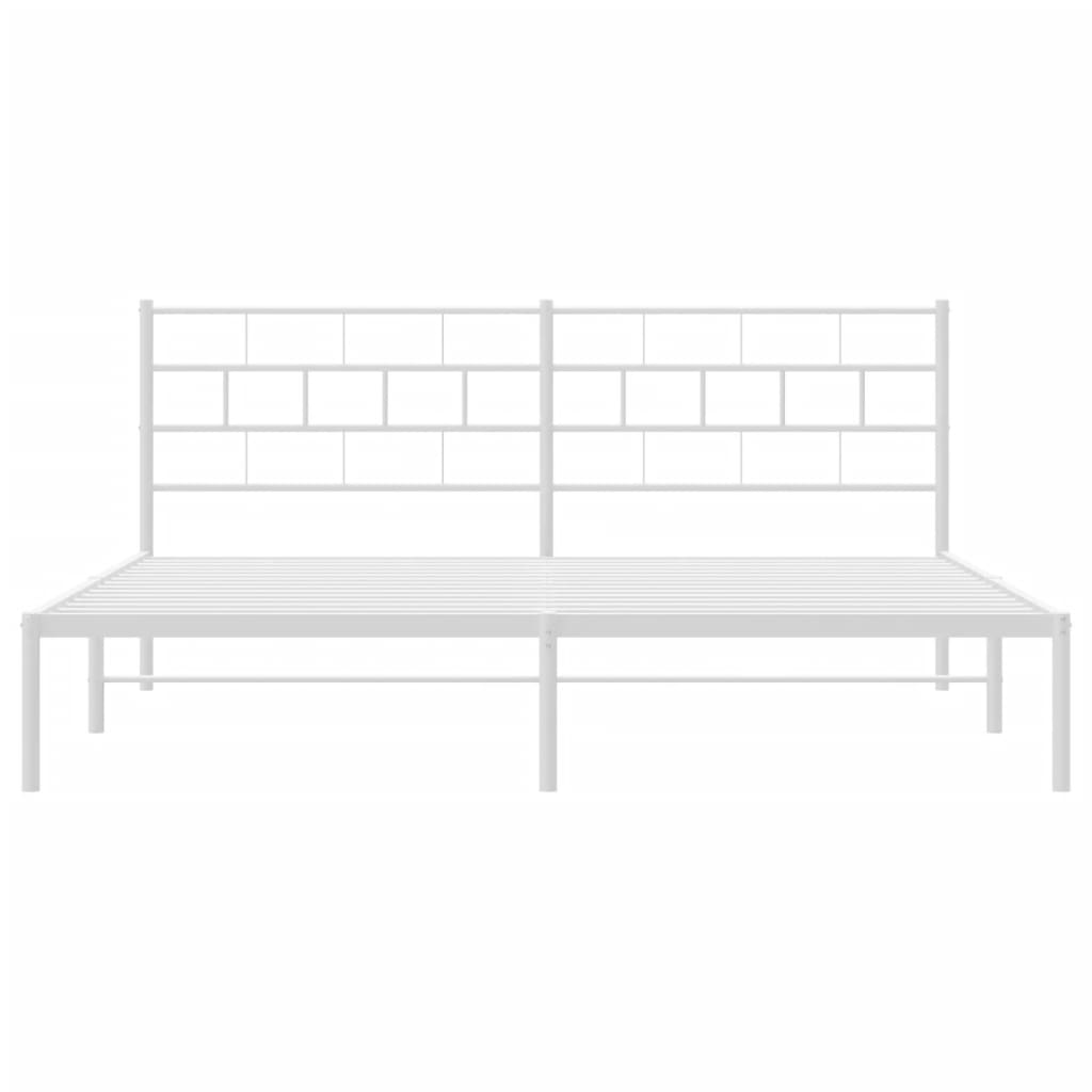 White metal king bed frame with minimalist headboard and footboard styled with neutral bedding and abstract wall art
