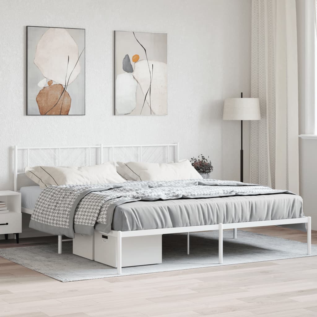 White metal frame bed with diamond pattern headboard and neutral bedding