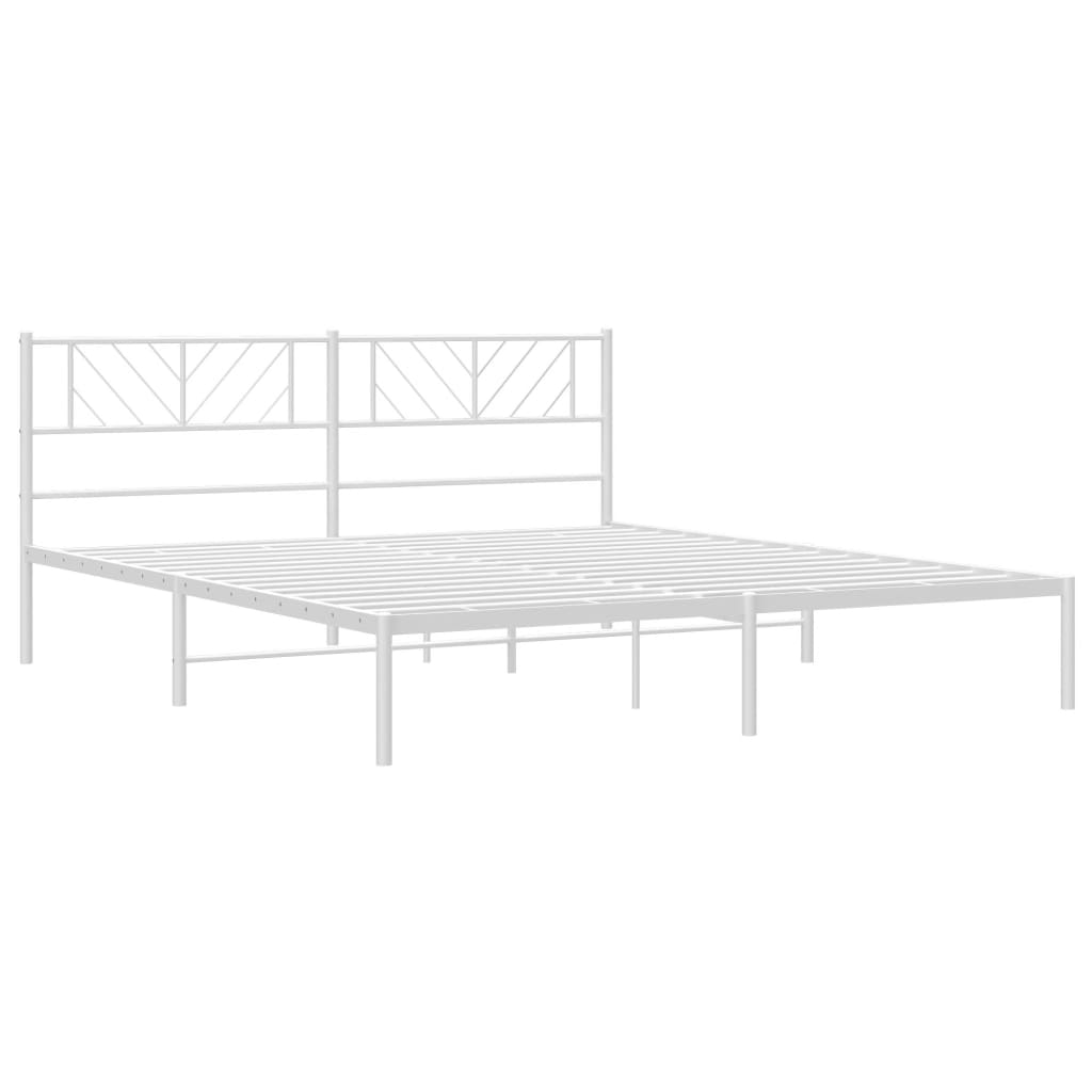 White metal queen bed frame with intricate headboard detail
