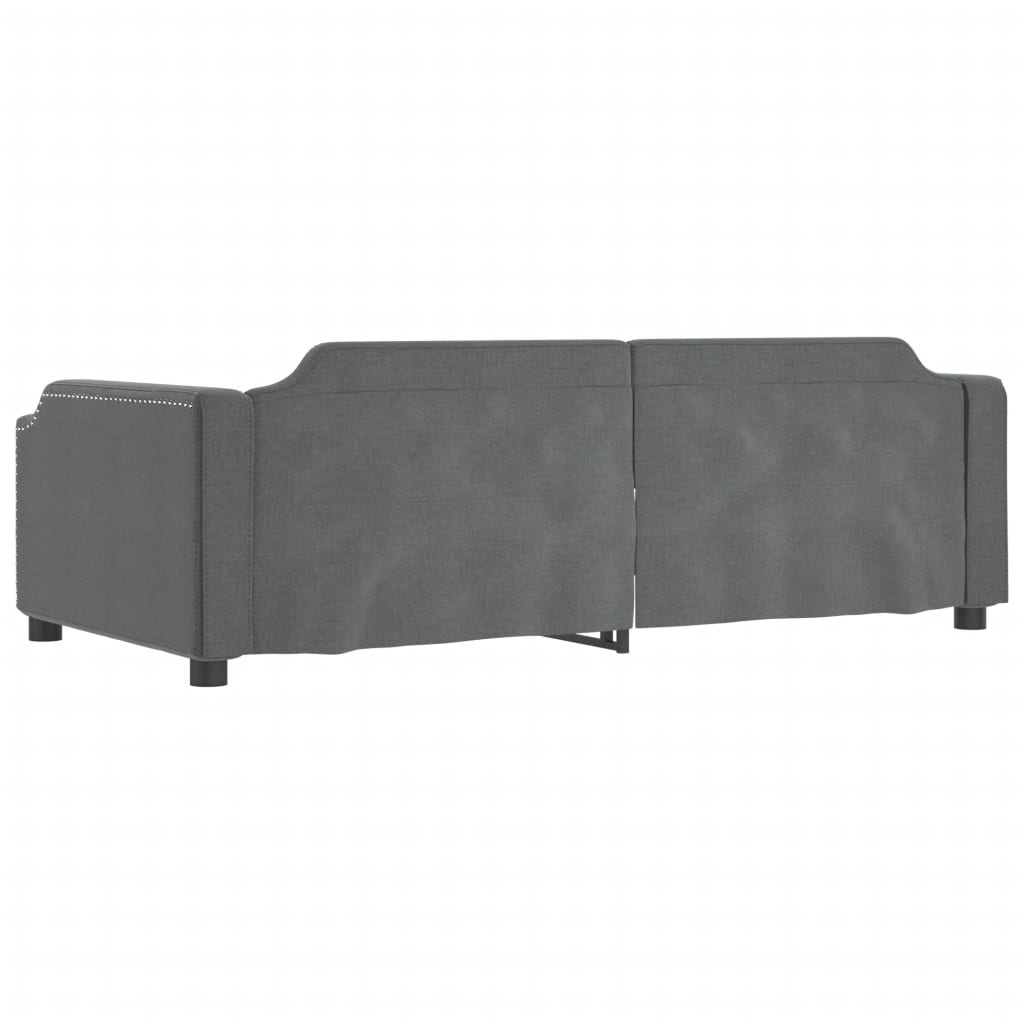 Gray upholstered daybed with tufted back and wooden slats