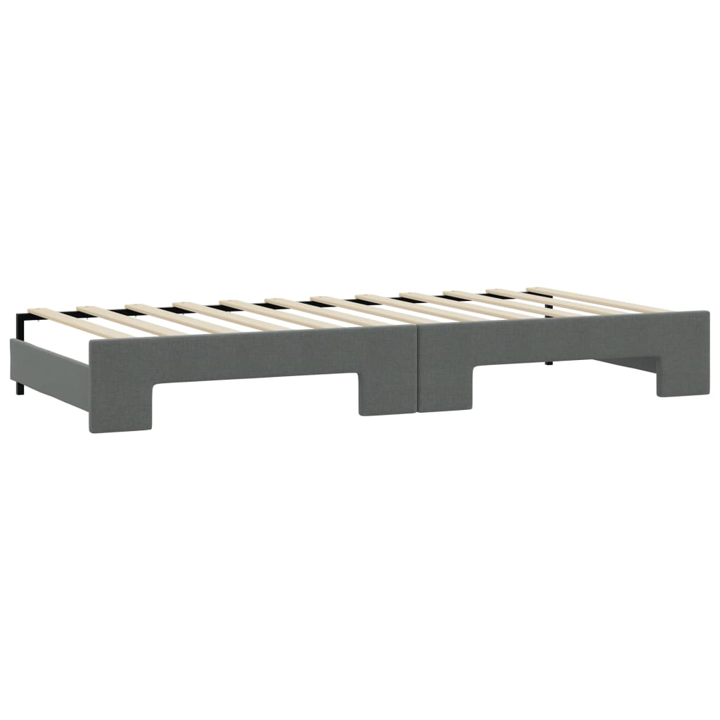 Dark grey fabric sectional sofa from the back showcasing studded armrest