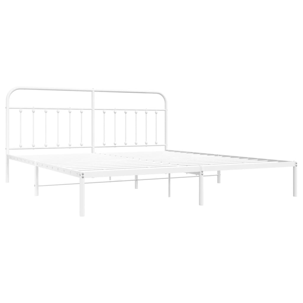 White metal bed frame with a classic headboard and a mattress