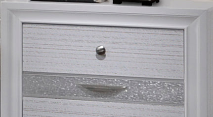 White wood bedside table with textured drawers and silver knob