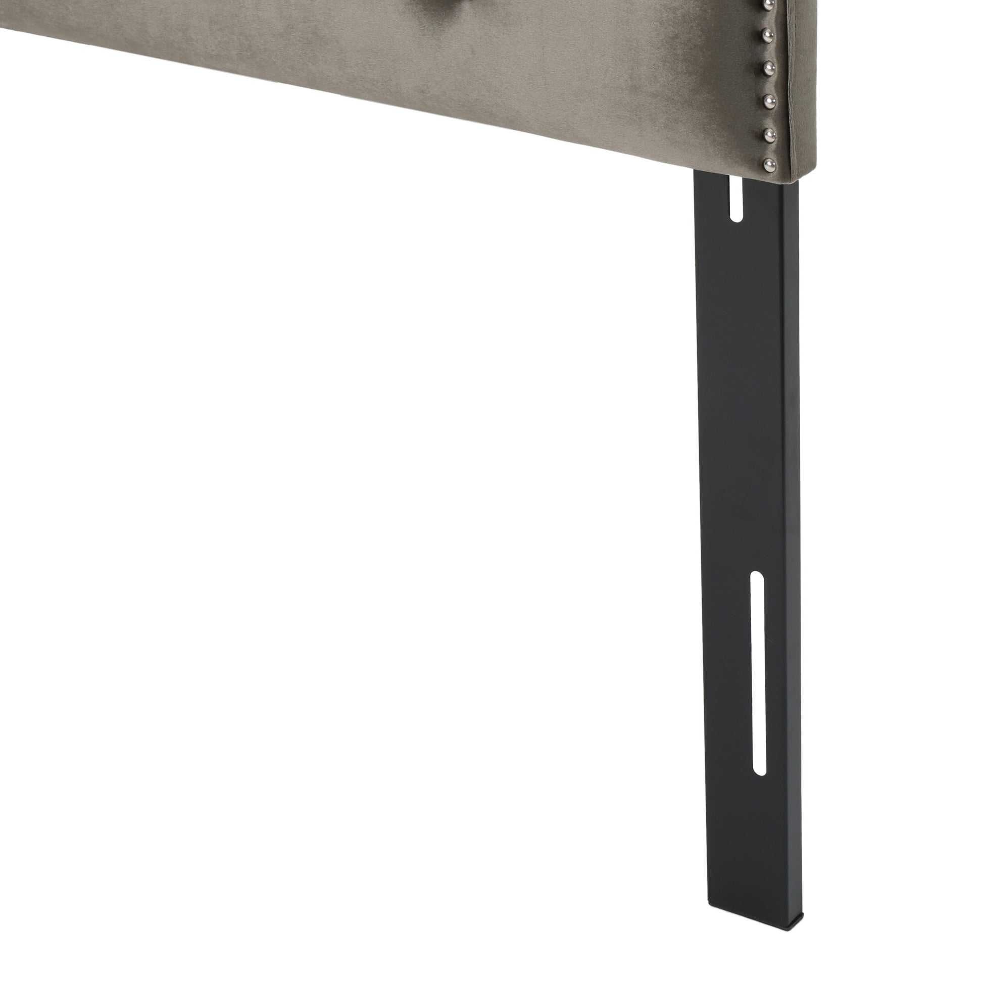Tufted grey velvet headboard with decorative nailhead trim and black metal leg