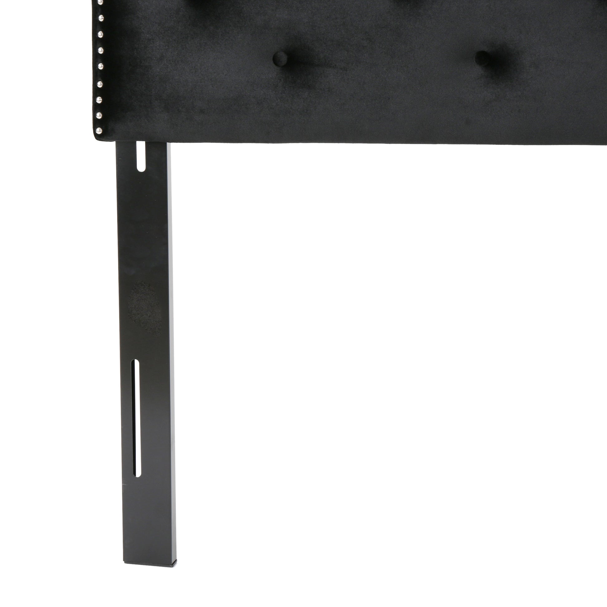 Black velvet headboard with silver nailhead trim and tufted buttons