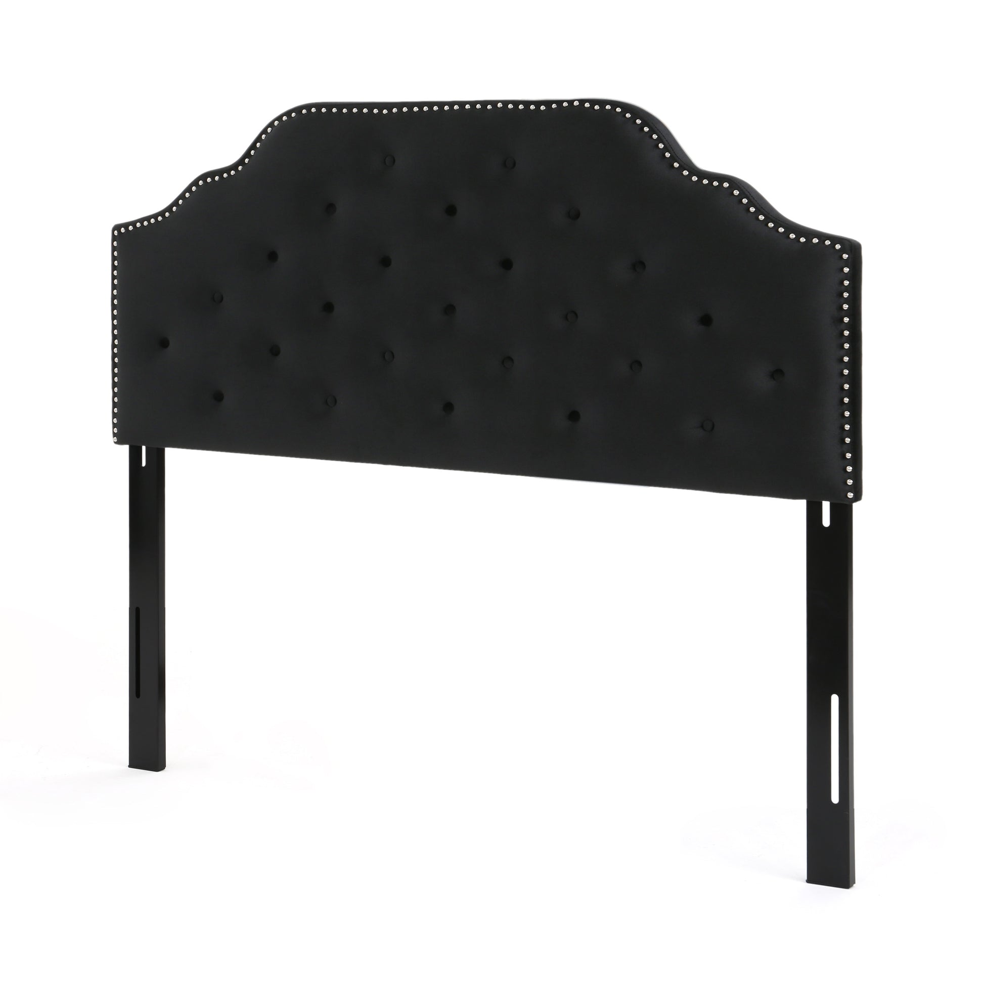 Black velvet arched headboard with diamond tufting and silver nailhead trim