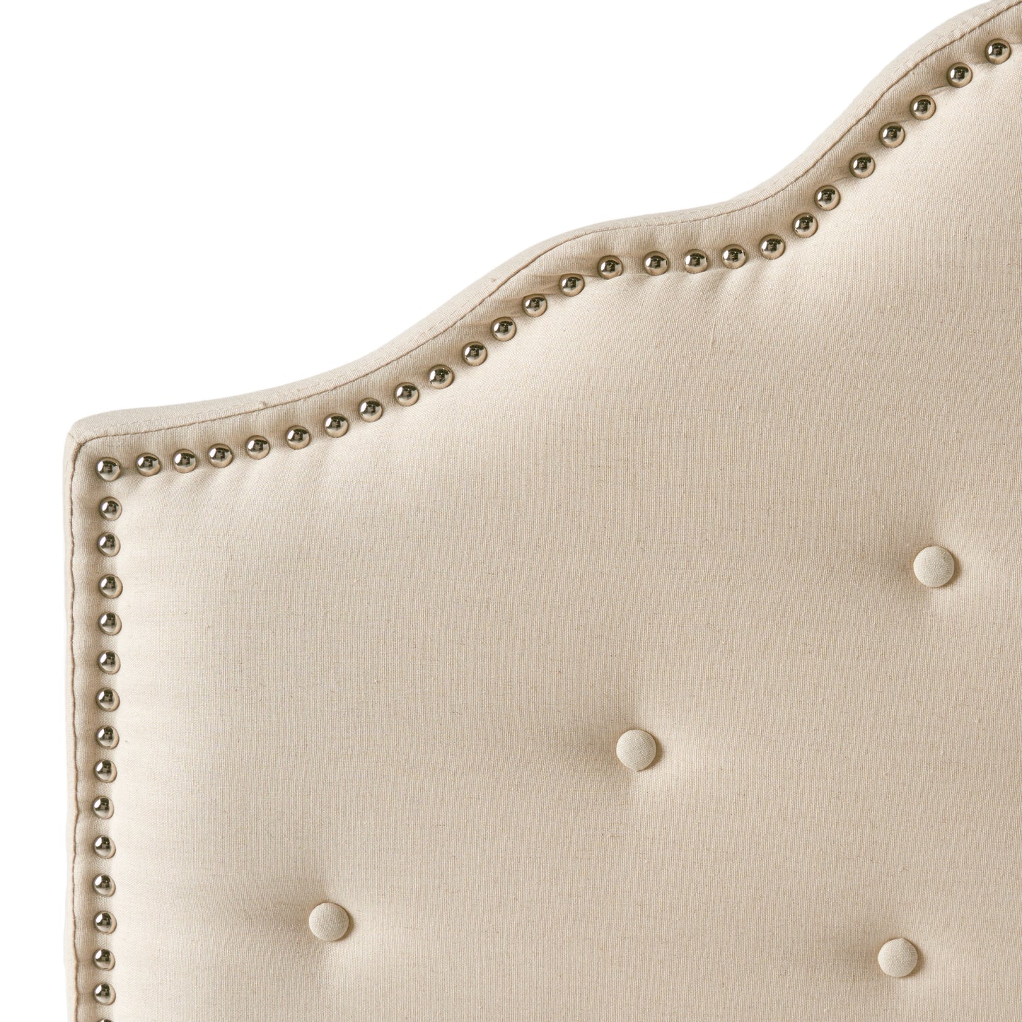 Cream linen headboard with silver nailhead trim and tufted buttons