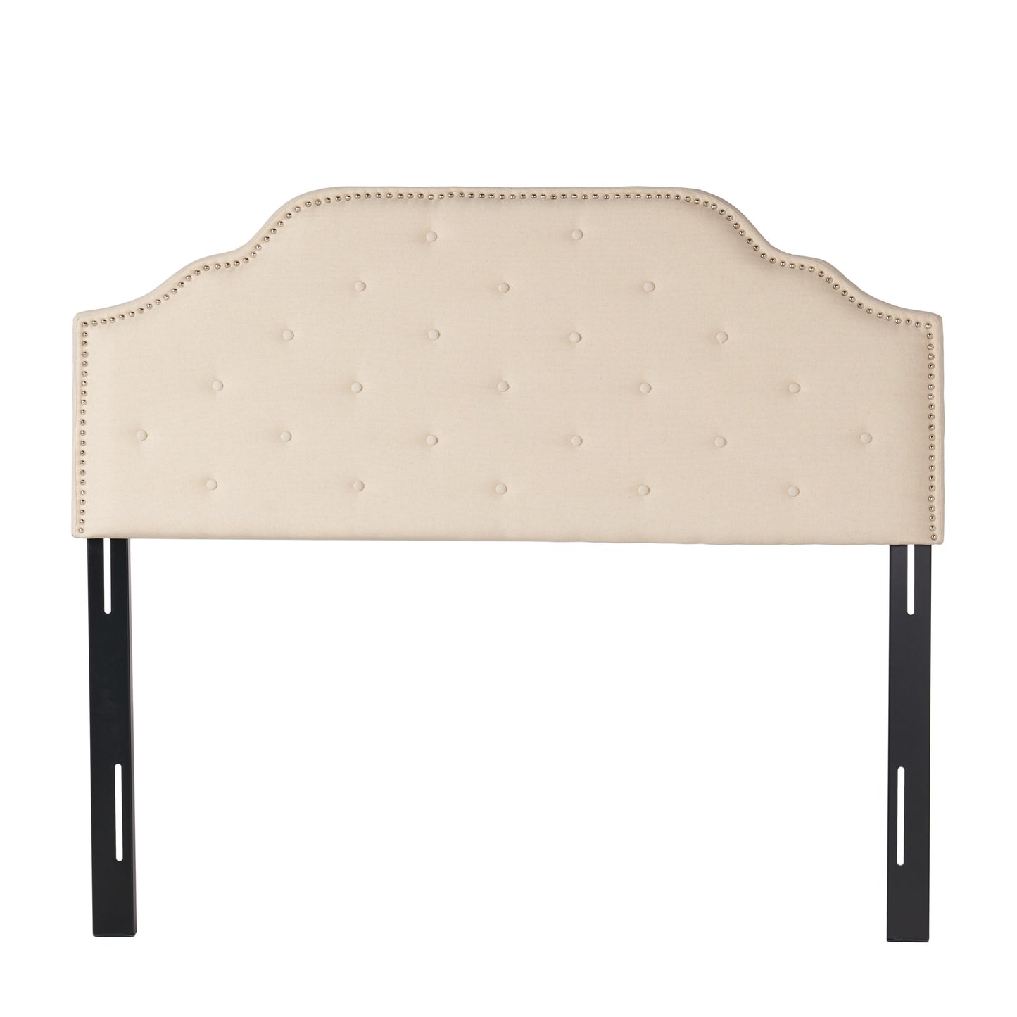 Tufted beige fabric headboard with silver nailhead trim and black metal legs