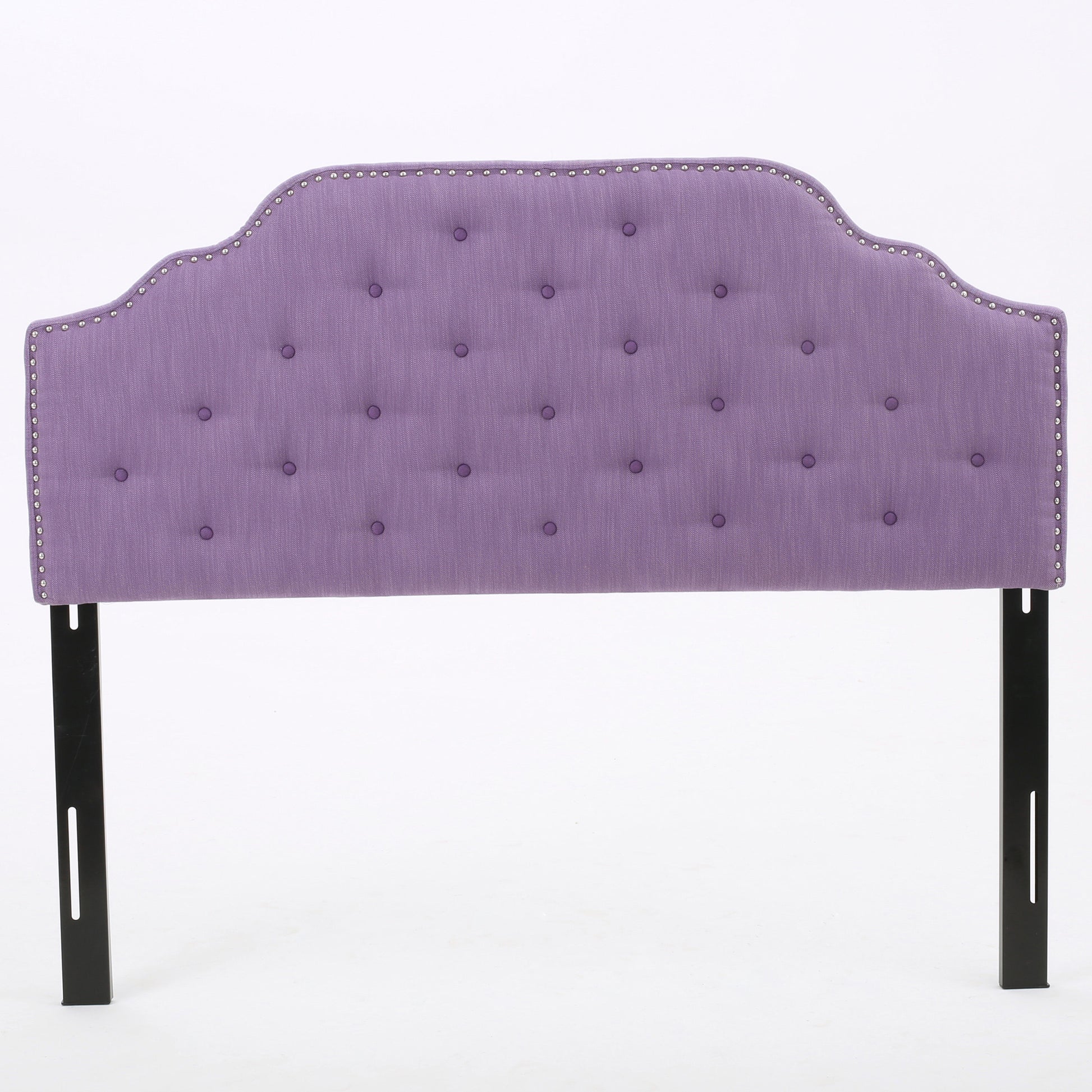 Purple tufted headboard with nailhead trim and black metal legs