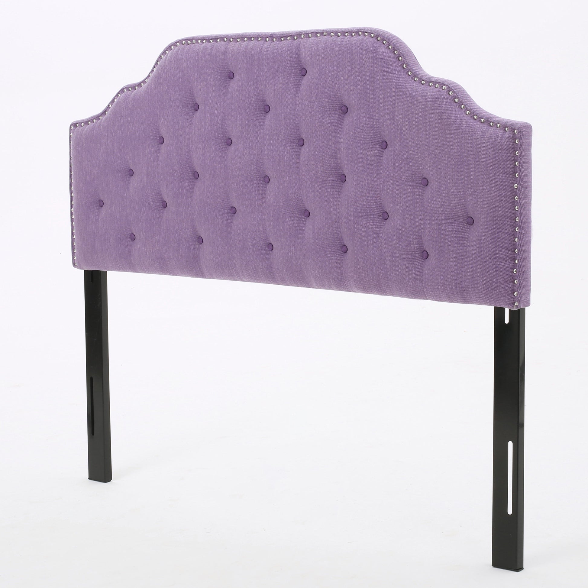 Lavender tufted headboard with silver nailhead trim and black legs